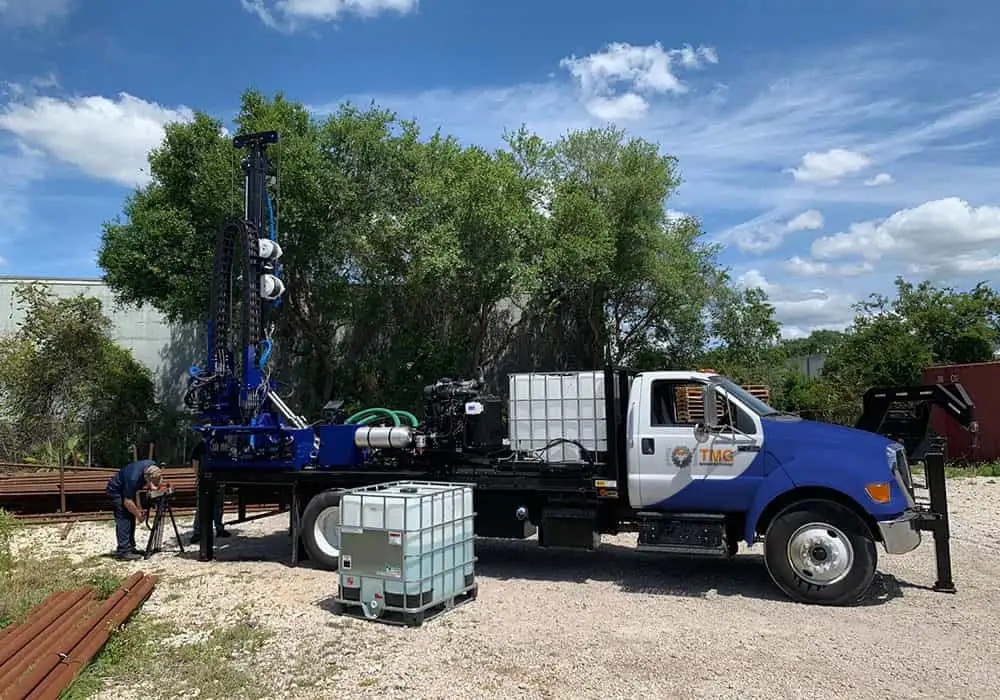 Drill rigs mounted on flatbed truck for spt testing and rotary core drilling.